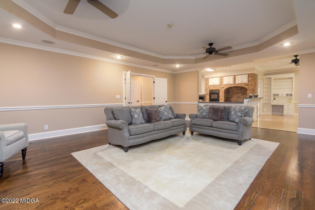 331 Country Creek Road Macon, GA 31220 - Photo 11 of 36 a living room with furniture and a rug