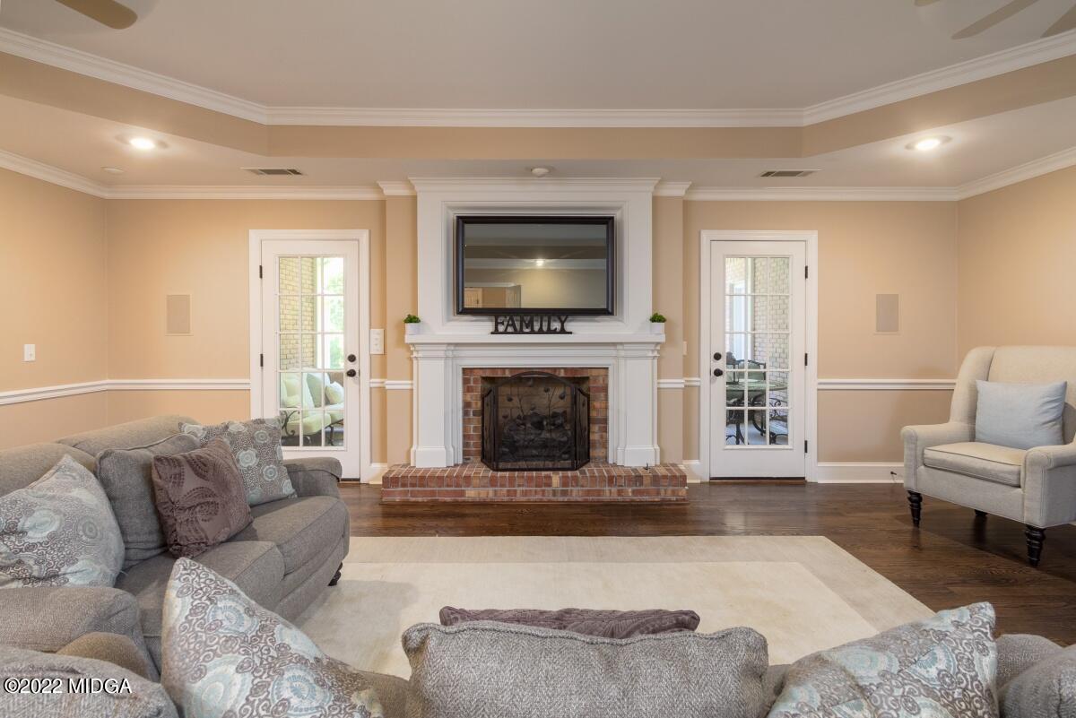 331 Country Creek Road Macon, GA 31220 - Photo 12 of 36 a living room with furniture and a fireplace
