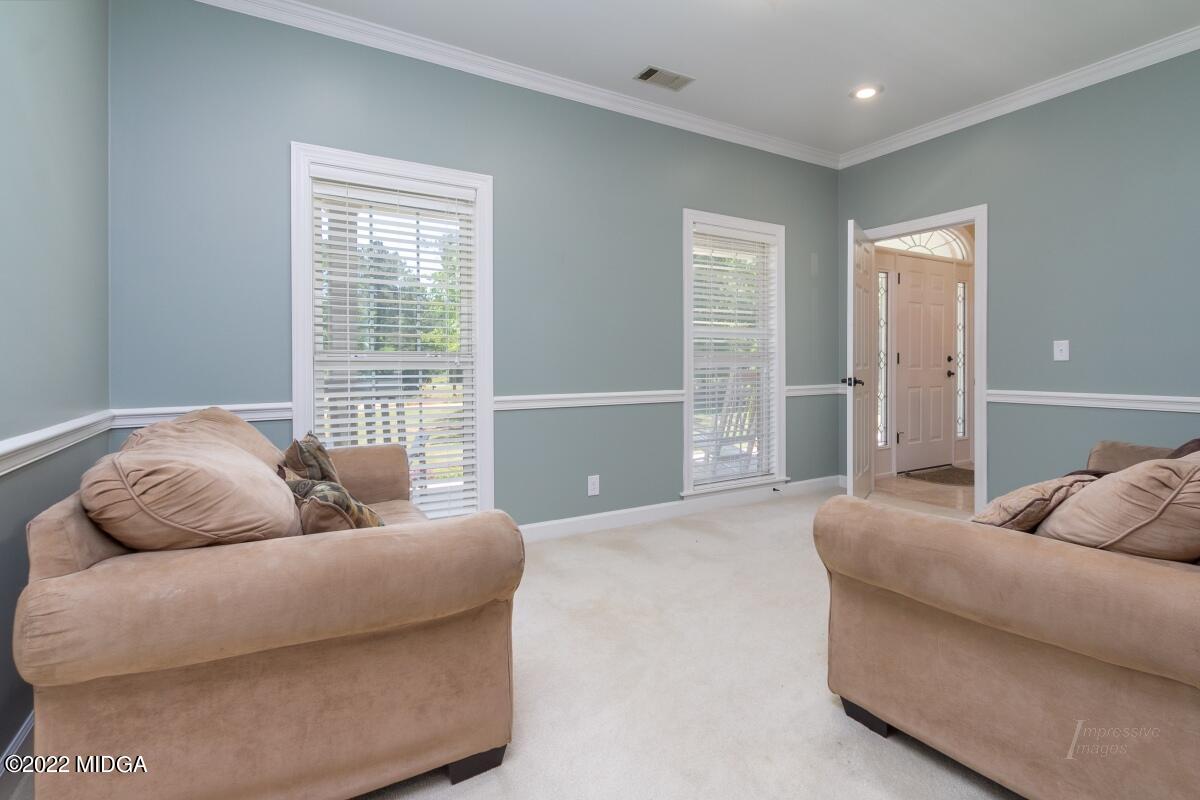 331 Country Creek Road Macon, GA 31220 - Photo 13 of 36 a living room with furniture and a large window