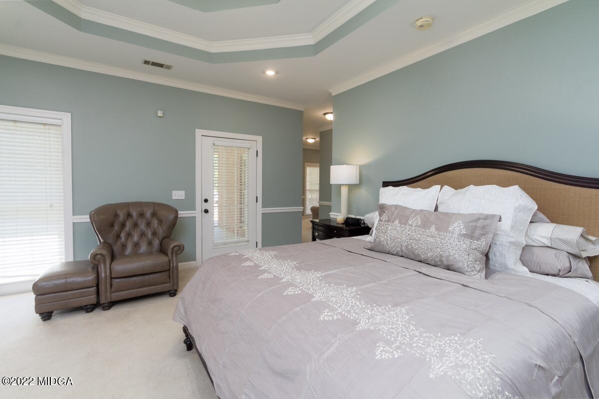 331 Country Creek Road Macon, GA 31220 - Photo 14 of 36 a spacious bedroom with a bed and couch