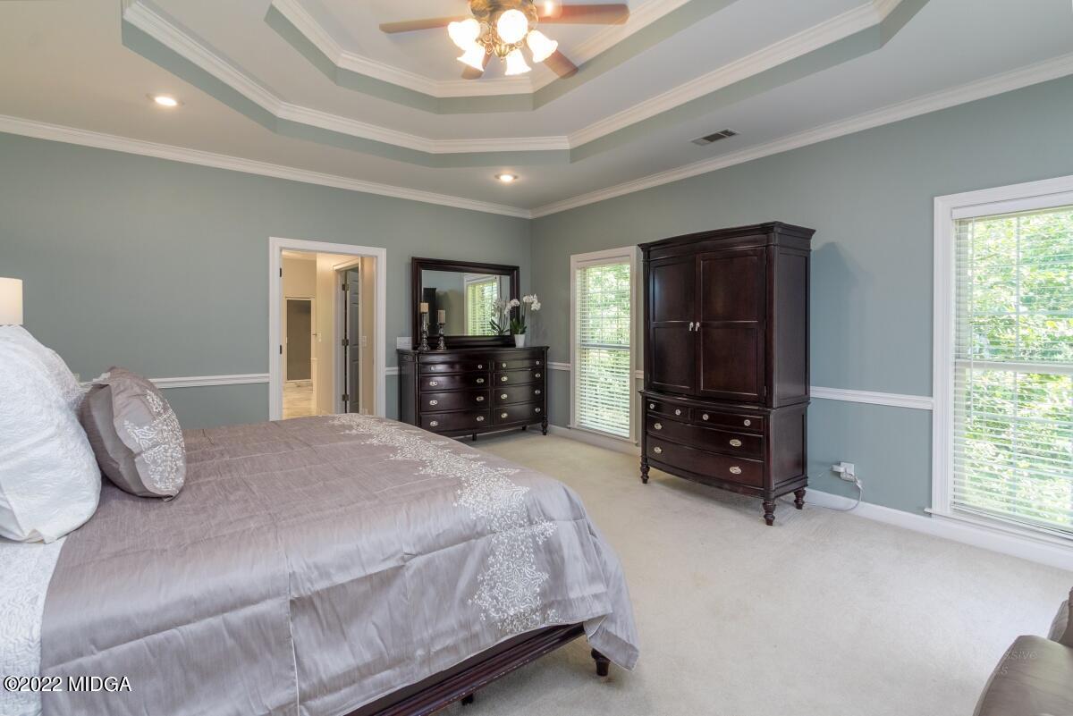 331 Country Creek Road Macon, GA 31220 - Photo 15 of 36 a bedroom with a bed and a television