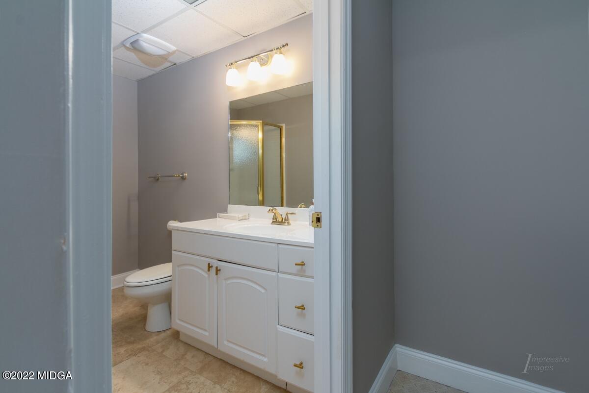 331 Country Creek Road Macon, GA 31220 - Photo 29 of 36 a bathroom with a sink a toilet and mirror