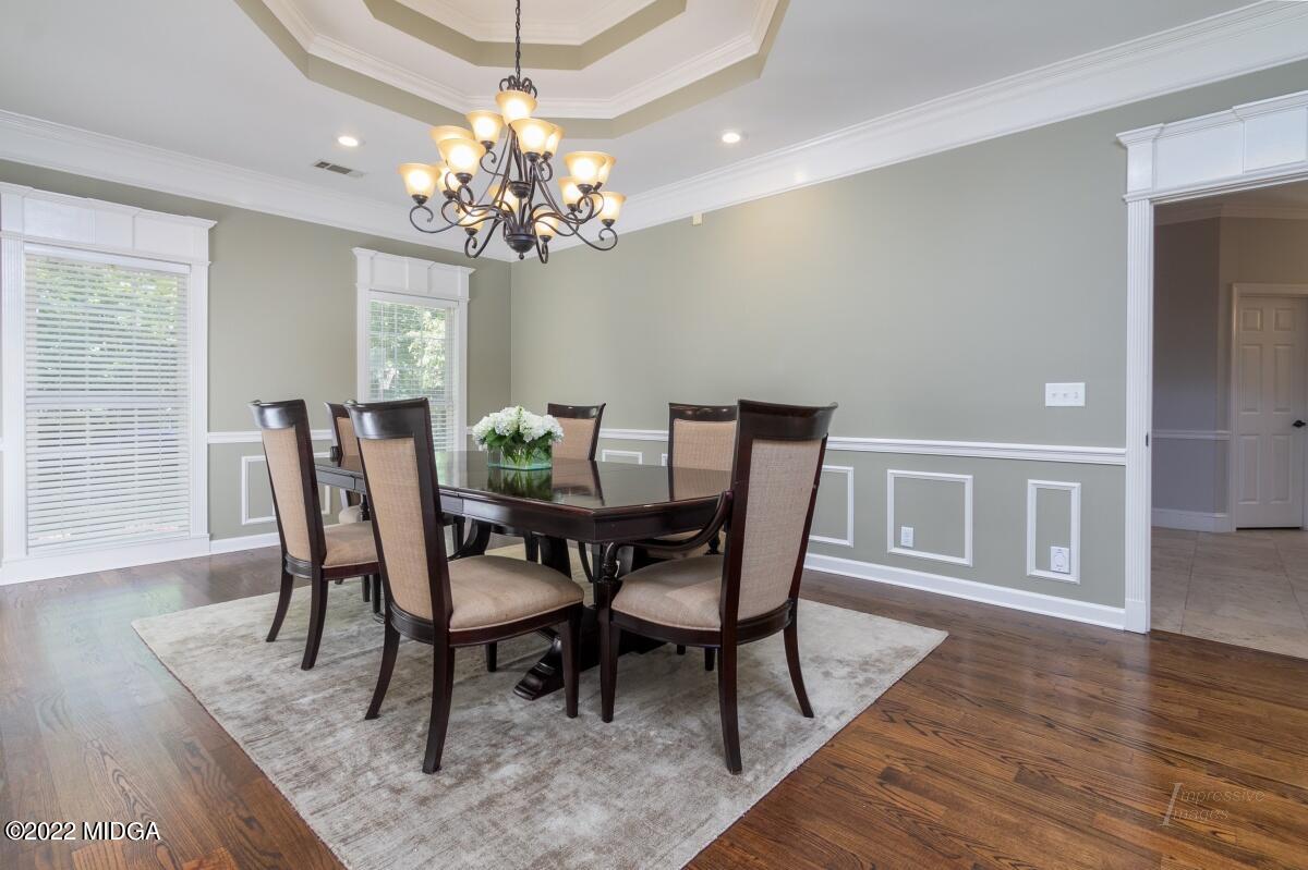 331 Country Creek Road Macon, GA 31220 - Photo 5 of 36 a view of a dining room with furniture and wooden floor