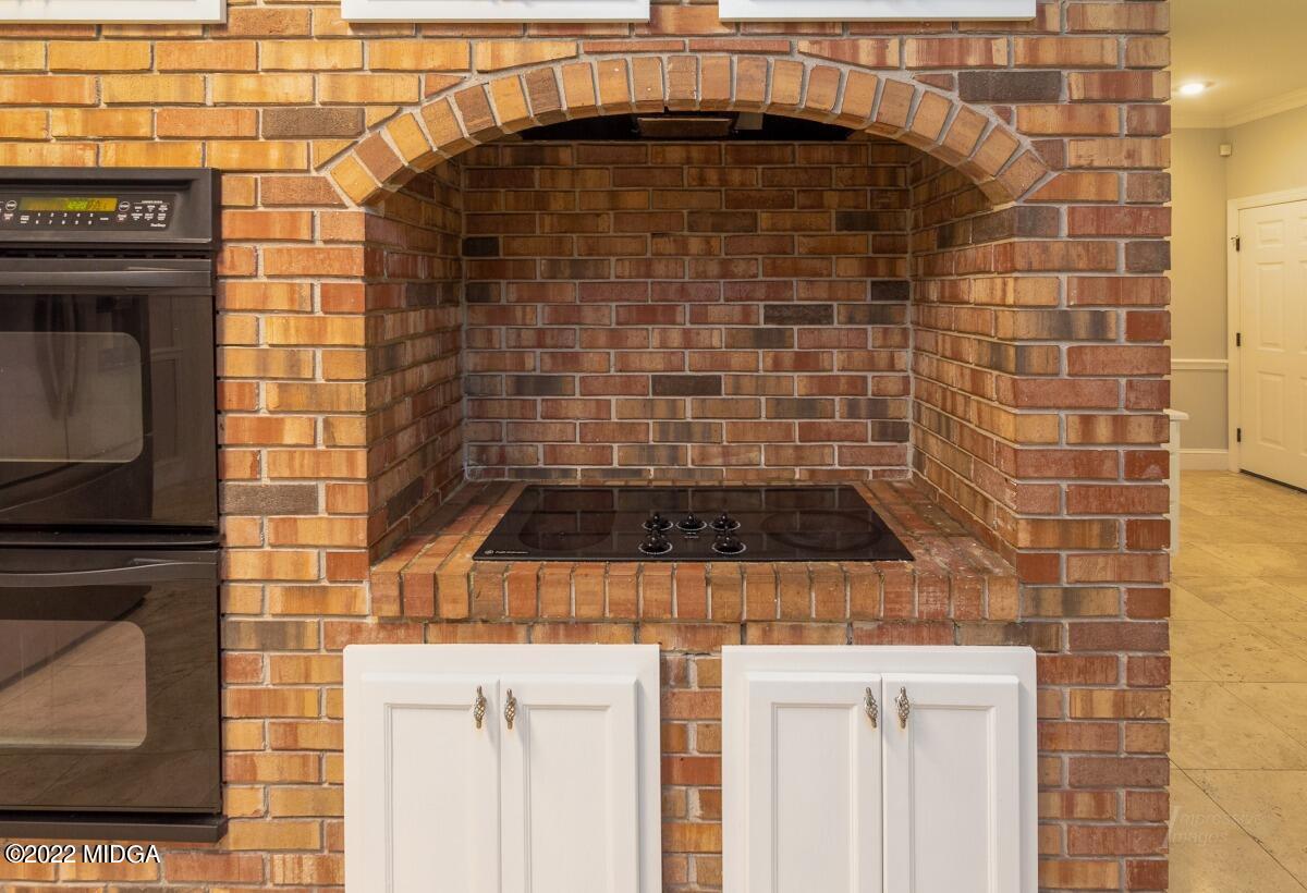 331 Country Creek Road Macon, GA 31220 - Photo 10 of 36 a stove top oven sitting inside of a kitchen