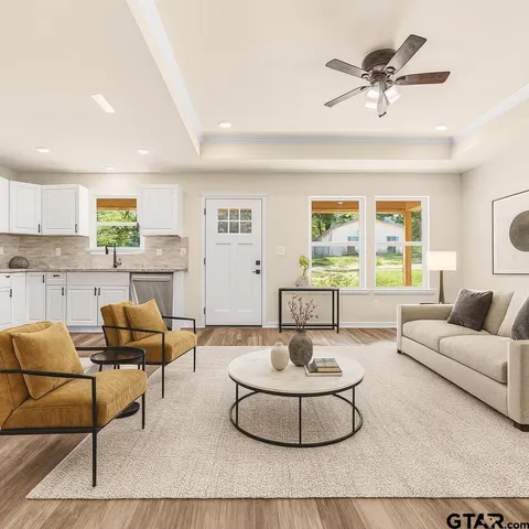 a living room with furniture and a large window