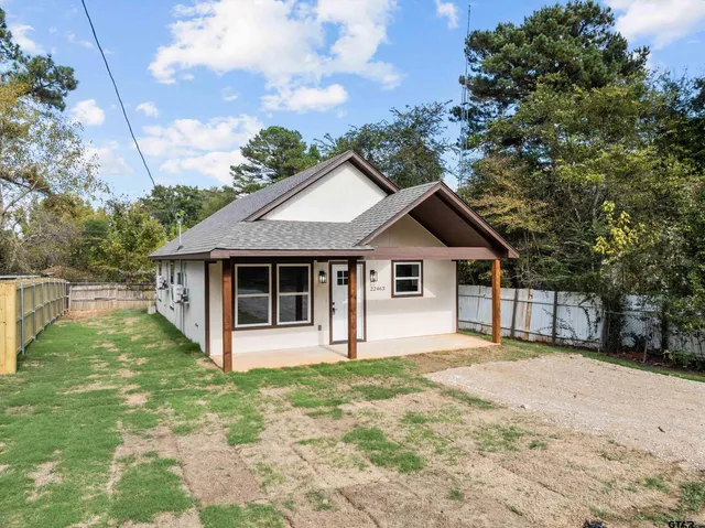 a house with trees in the background