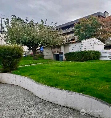 a view of house with a yard