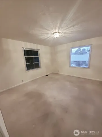 a kitchen with a stove top oven and cabinets