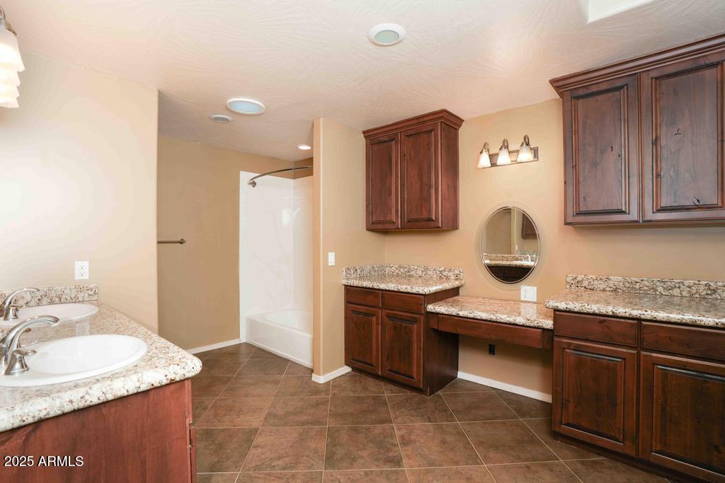 4330 East Navajo Lane Rimrock, AZ 86335 - Photo 29 of 59 a kitchen with stainless steel appliances granite countertop a sink stove and refrigerator