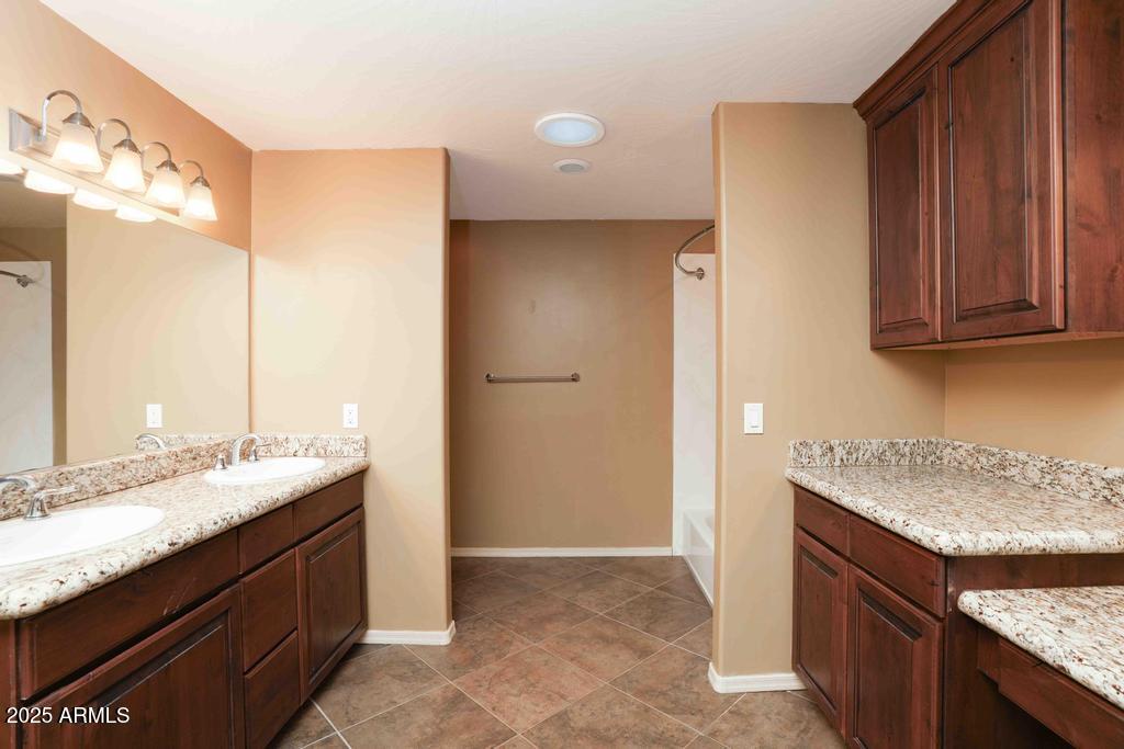 4330 East Navajo Lane Rimrock, AZ 86335 - Photo 30 of 59 a bathroom with a granite countertop sink and a mirror
