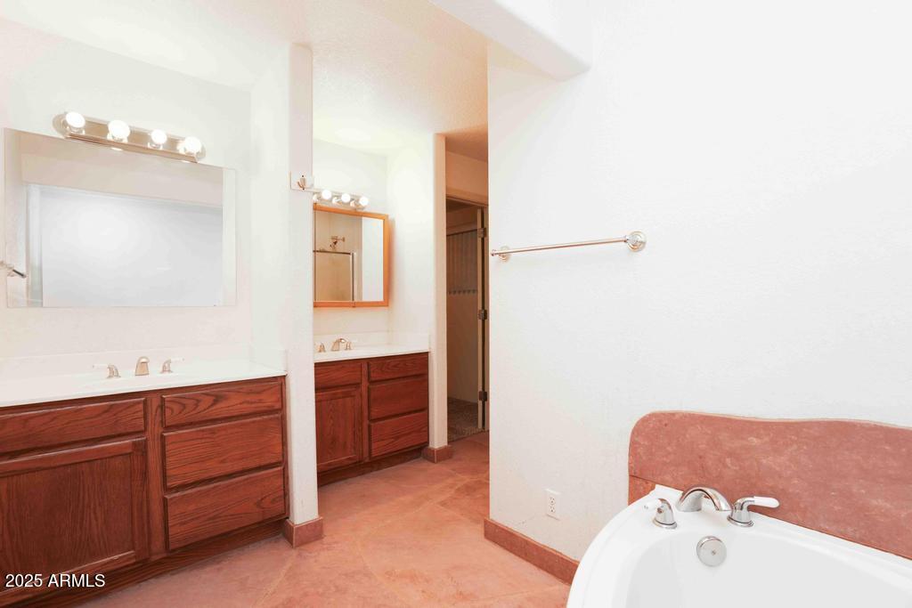 4330 East Navajo Lane Rimrock, AZ 86335 - Photo 37 of 59 a bathroom with a bathtub sink and mirror