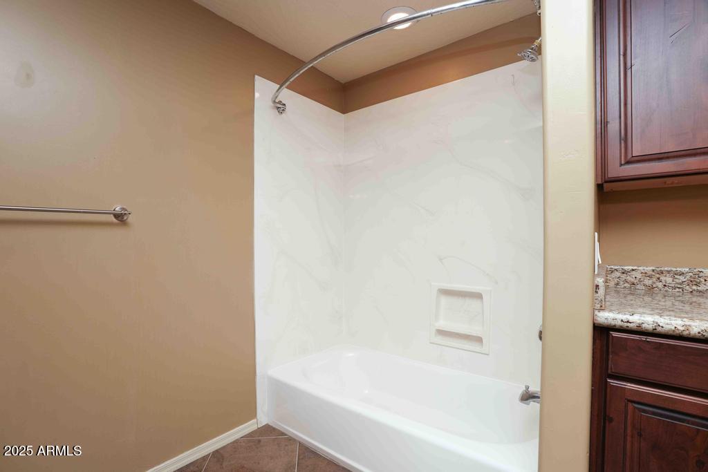 4330 East Navajo Lane Rimrock, AZ 86335 - Photo 42 of 59 a bathroom with a bathtub and a shower