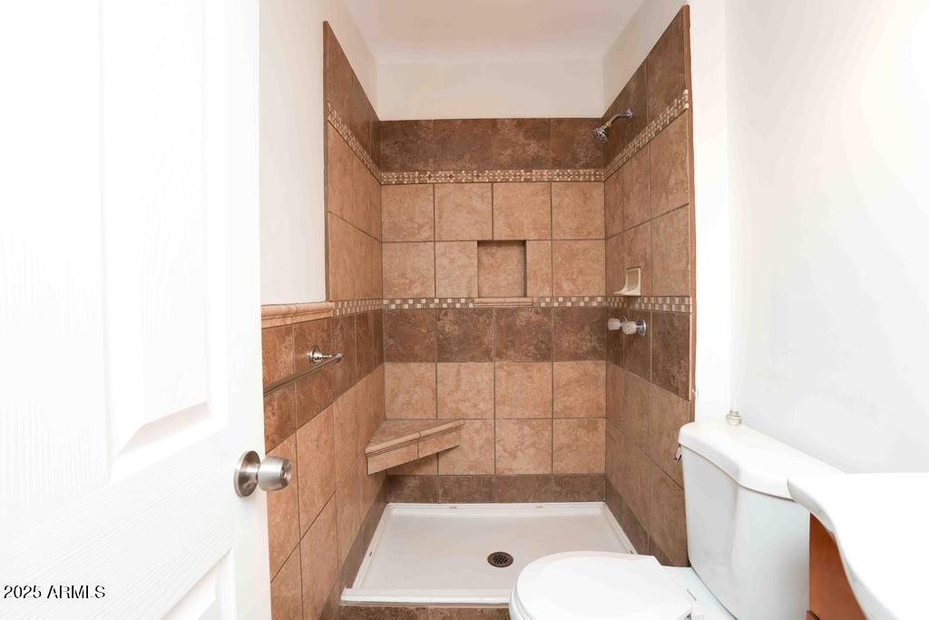 4330 East Navajo Lane Rimrock, AZ 86335 - Photo 46 of 59 a bathroom with a shower and a toilet