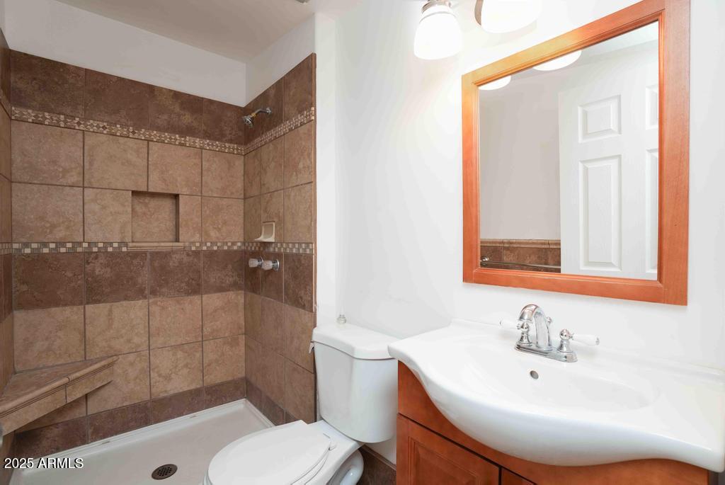 4330 East Navajo Lane Rimrock, AZ 86335 - Photo 47 of 59 a bathroom with a sink a toilet and shower