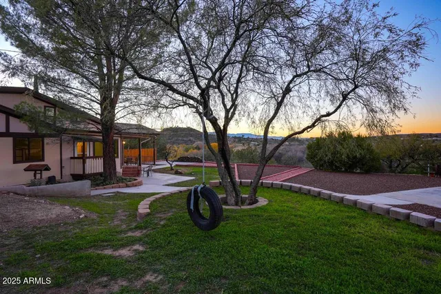 a front view of a house with sitting area