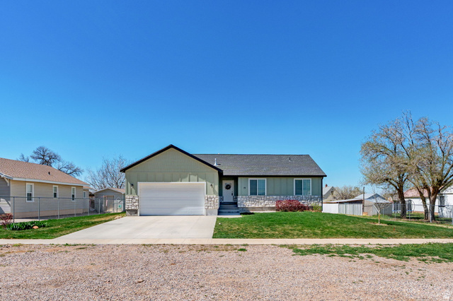 75 North 100th Street West Fillmore, UT 84631 - Photo 60 of 62 Single story home with board and batten siding, driveway, and a garage