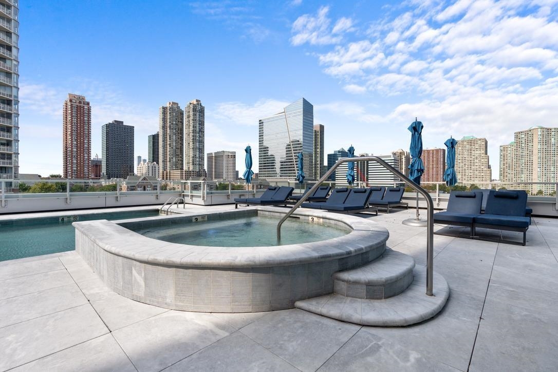 2 2nd Street, Unit 4001 Jersey City, NJ 07302 - Photo 23 of 31 a view of outdoor space with swimming pool