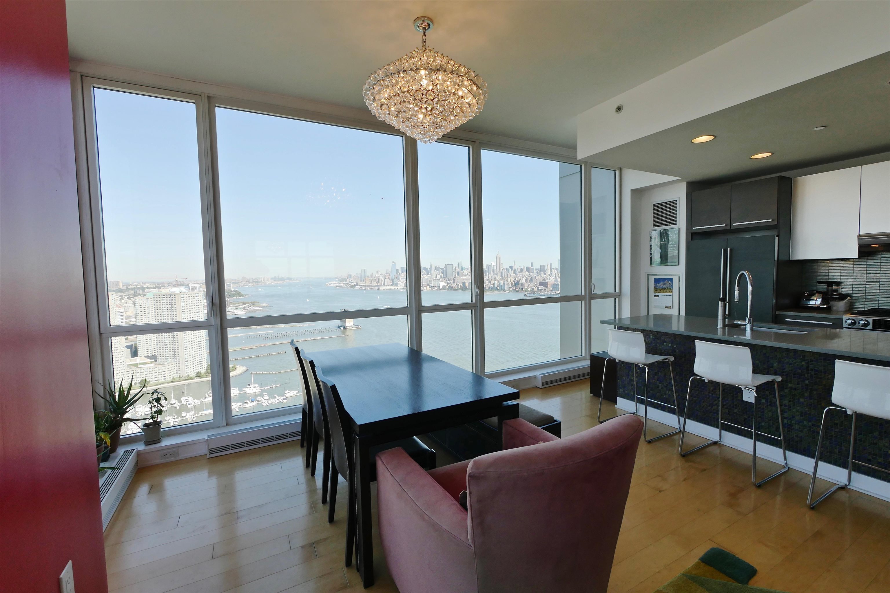2 2nd Street, Unit 4001 Jersey City, NJ 07302 - Photo 30 of 31 a living room with furniture and a large window