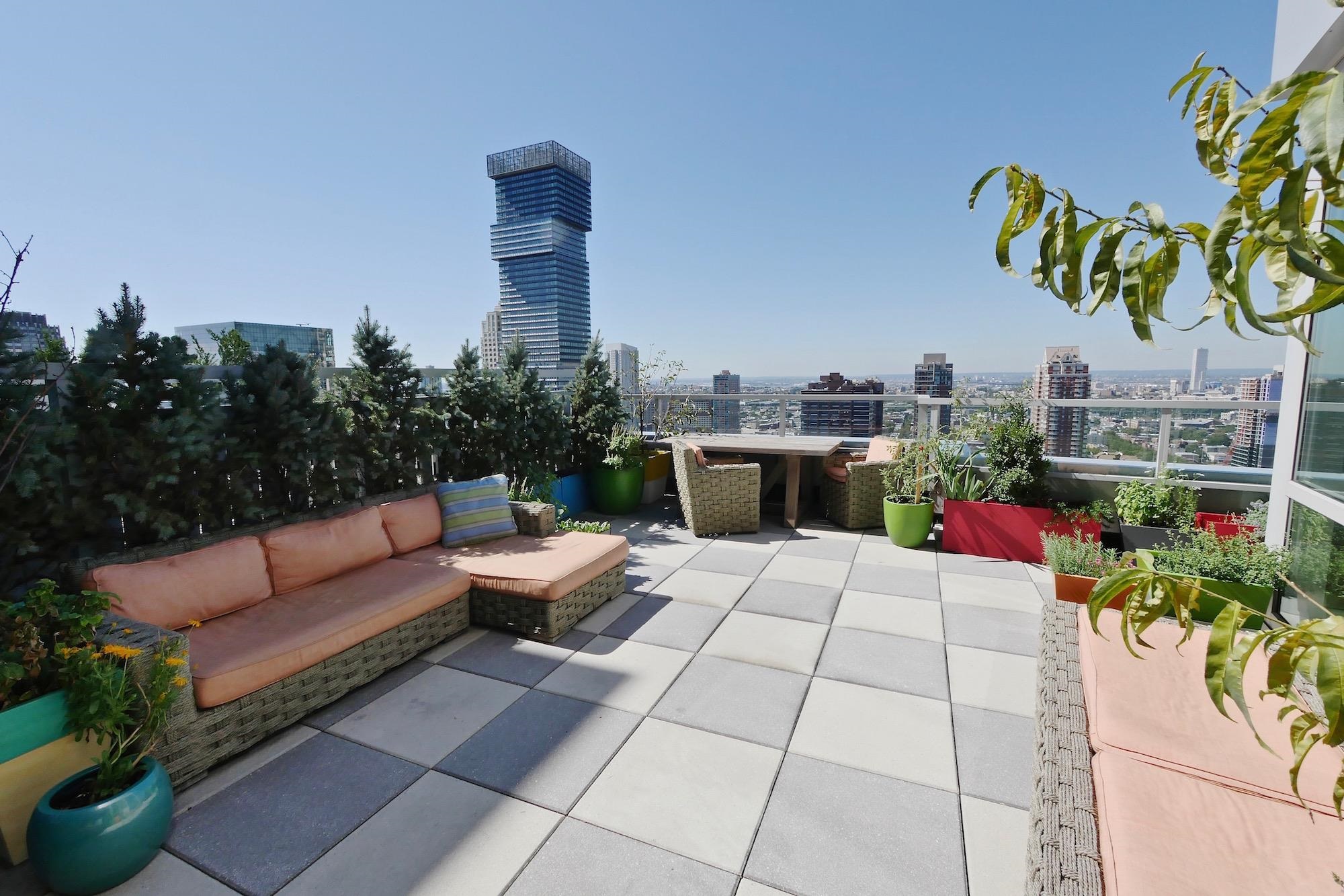 2 2nd Street, Unit 4001 Jersey City, NJ 07302 - Photo 6 of 31 a view of a terrace with furniture