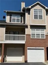 a front view of a house with a balcony