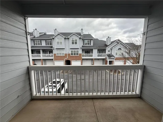 a view of a balcony with a iron gate