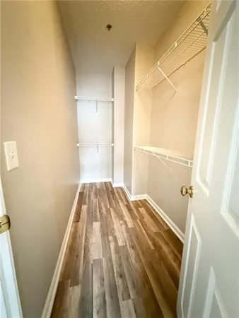 a view of bedroom with a bed and hardwood