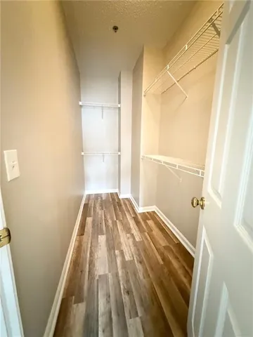 a view of bedroom with a bed and hardwood
