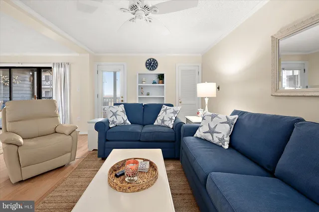 a large white kitchen with stainless steel appliances