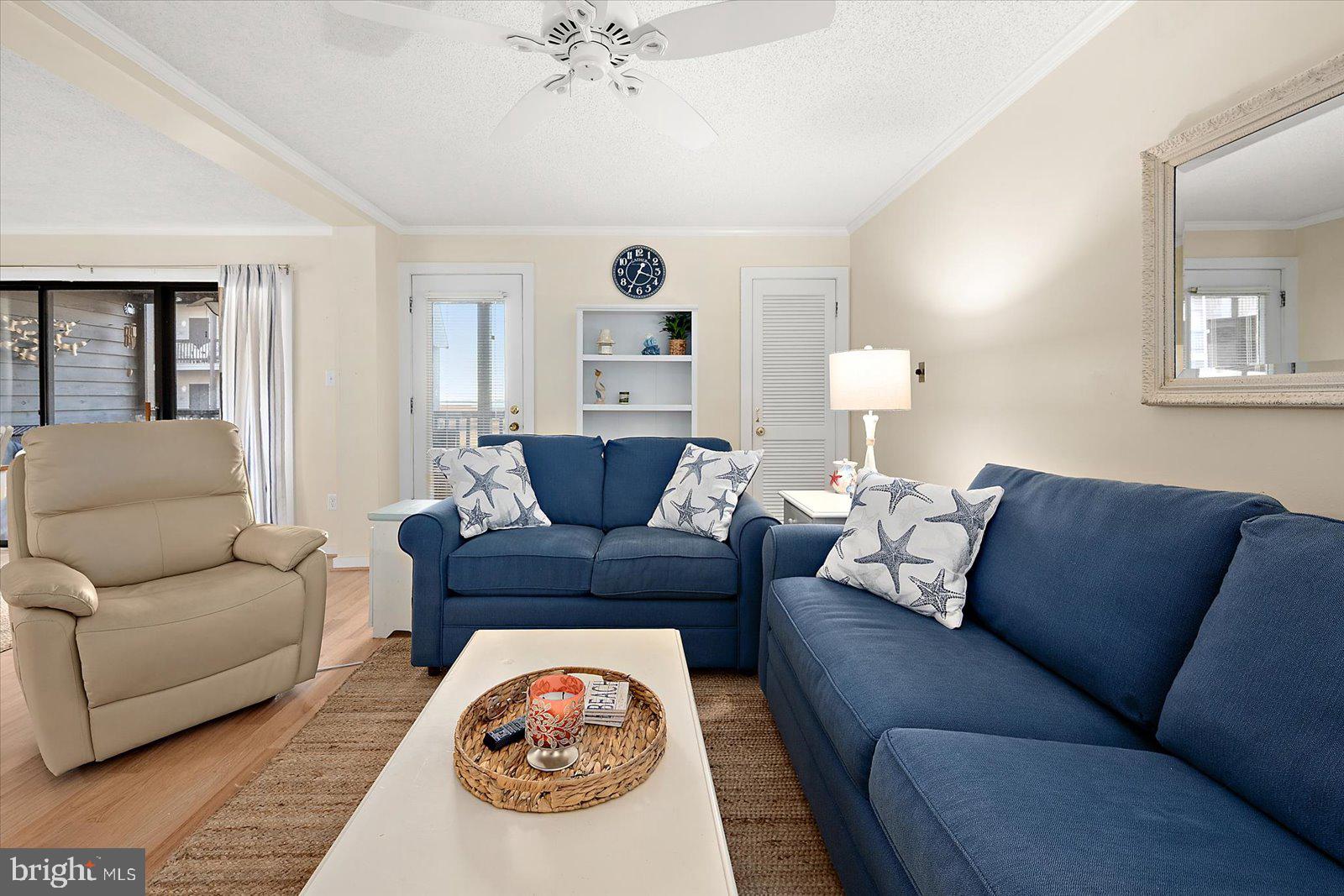 119 Old Landing Road, Unit 102A Ocean City, MD 21842 - Photo 15 of 47 a living room with furniture and a rug