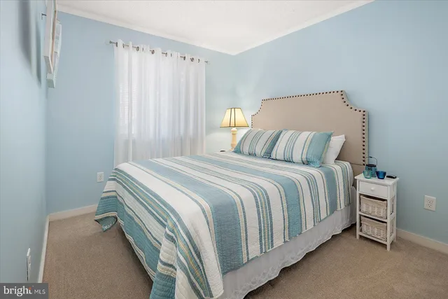 a bedroom with a bed and a mirror