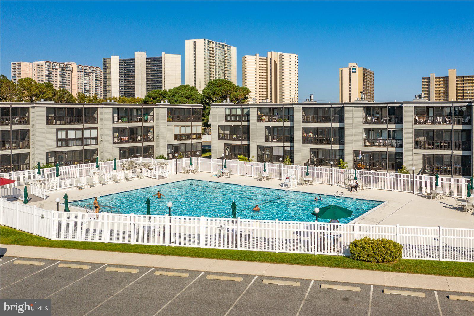 119 Old Landing Road, Unit 102A Ocean City, MD 21842 - Photo 40 of 47 a view of swimming pool of water with tall buildings