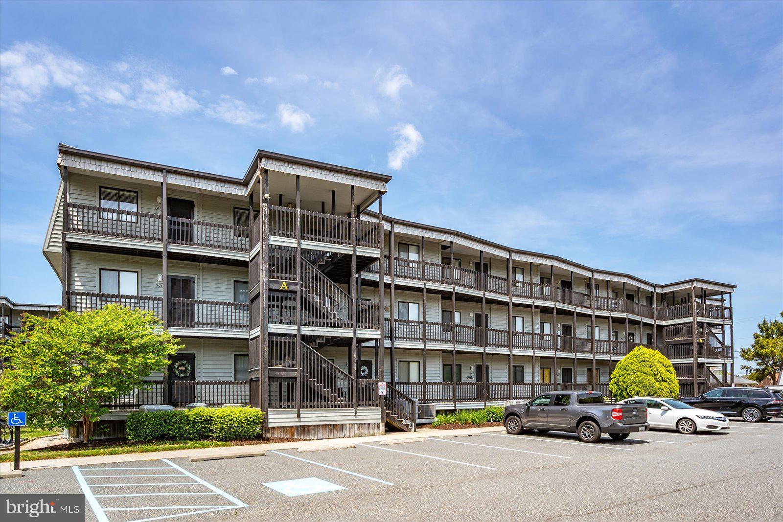 119 Old Landing Road, Unit 102A Ocean City, MD 21842 - Photo 44 of 47 a car parked in front of a building