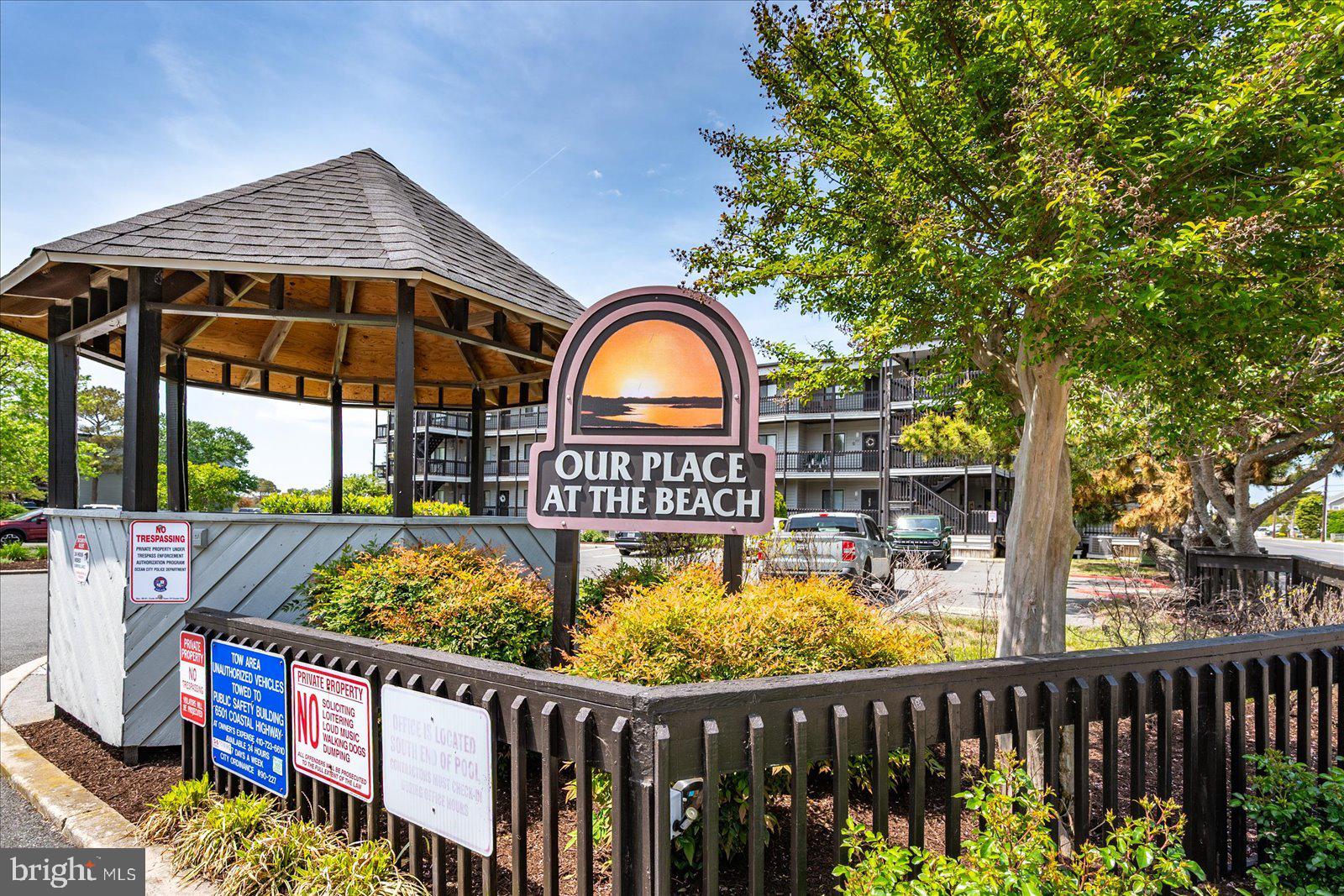 119 Old Landing Road, Unit 102A Ocean City, MD 21842 - Photo 45 of 47 a view of a wooden house with a swimming pool