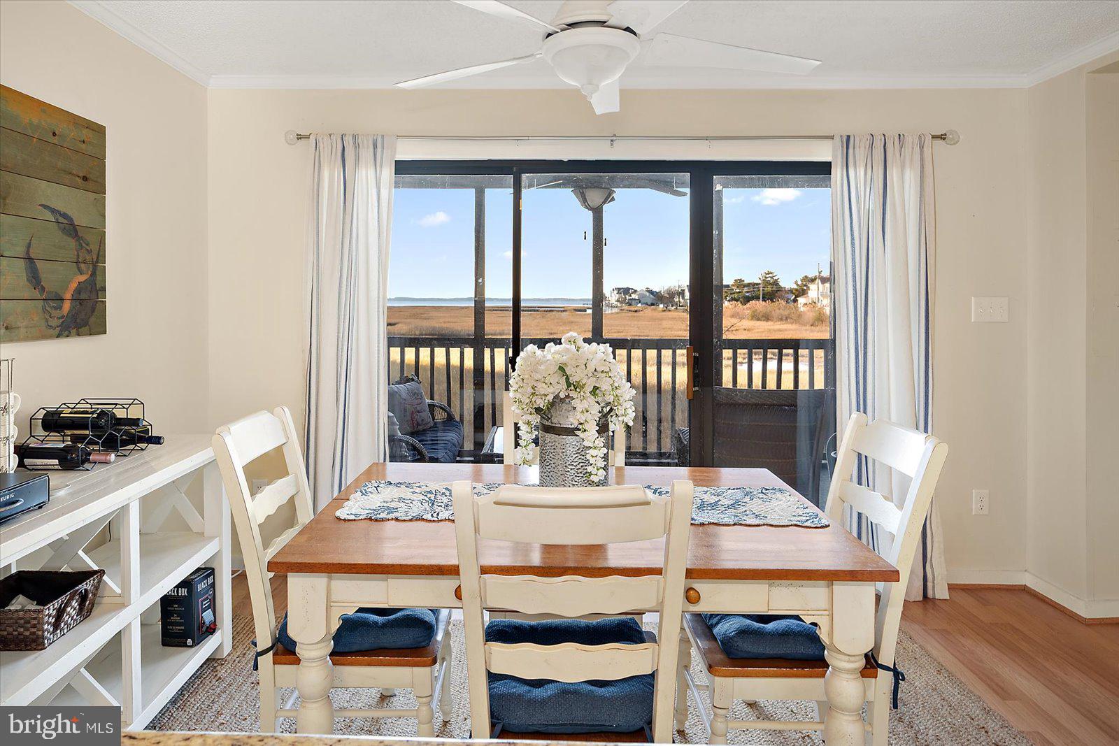 119 Old Landing Road, Unit 102A Ocean City, MD 21842 - Photo 10 of 47 a view of a dining room with furniture window and outside view