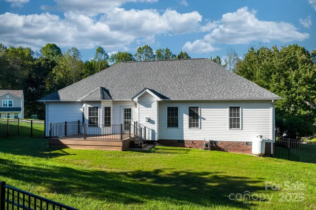 a aerial view of a house with swimming pool yard and patio