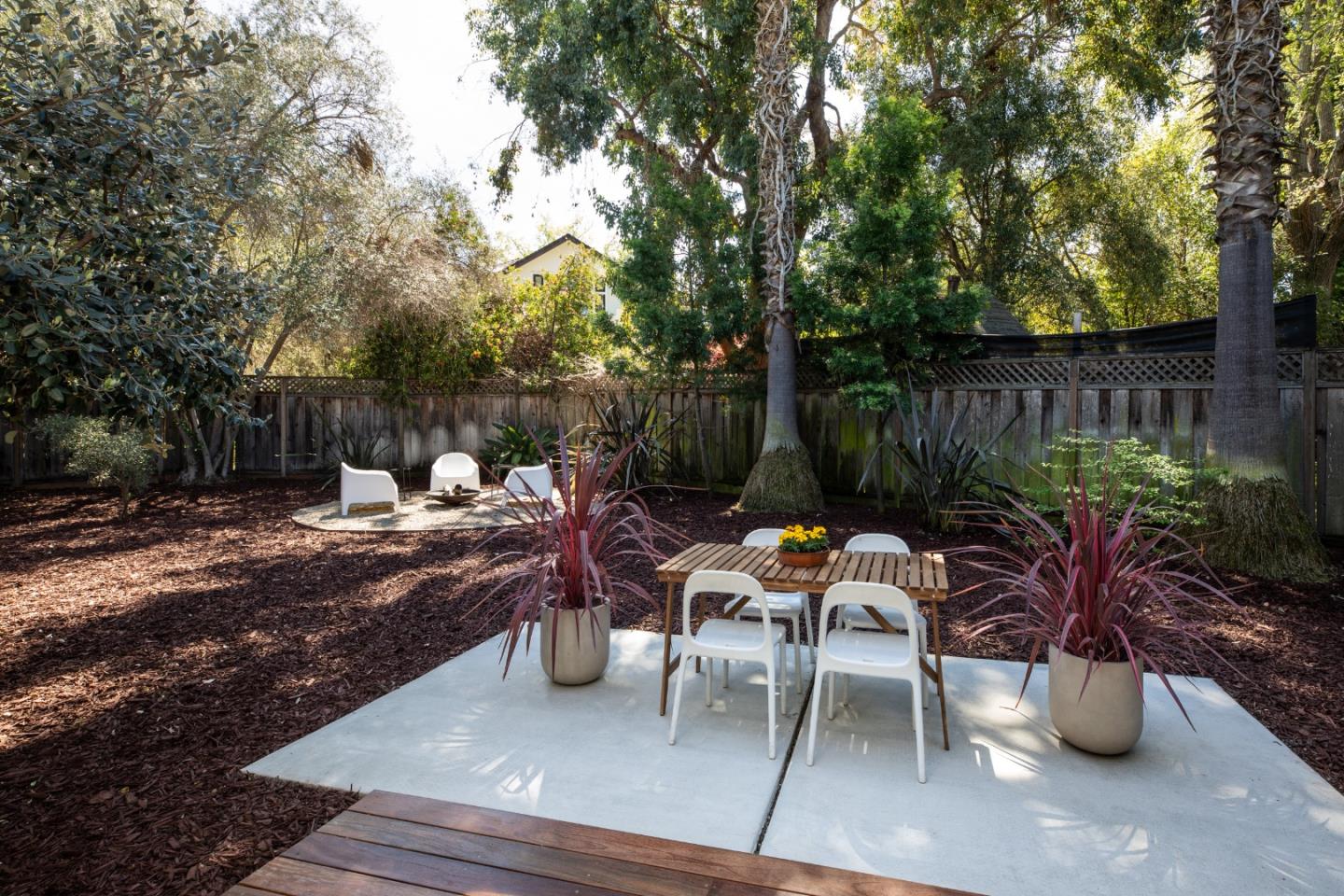 840 Sutter Avenue Palo Alto, CA 94303 - Photo 13 of 26 a view of a backyard with sitting area and garden