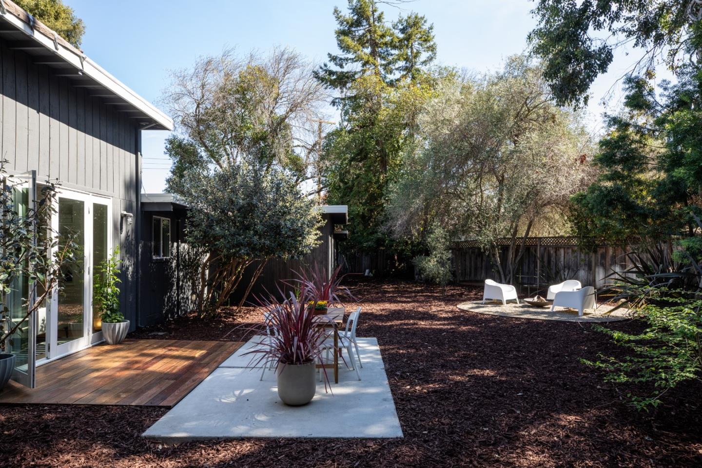 840 Sutter Avenue Palo Alto, CA 94303 - Photo 14 of 26 a view of a patio with chairs and potted plants