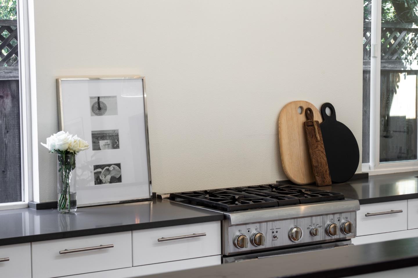 840 Sutter Avenue Palo Alto, CA 94303 - Photo 10 of 26 a view of a kitchen with stove and cabinets