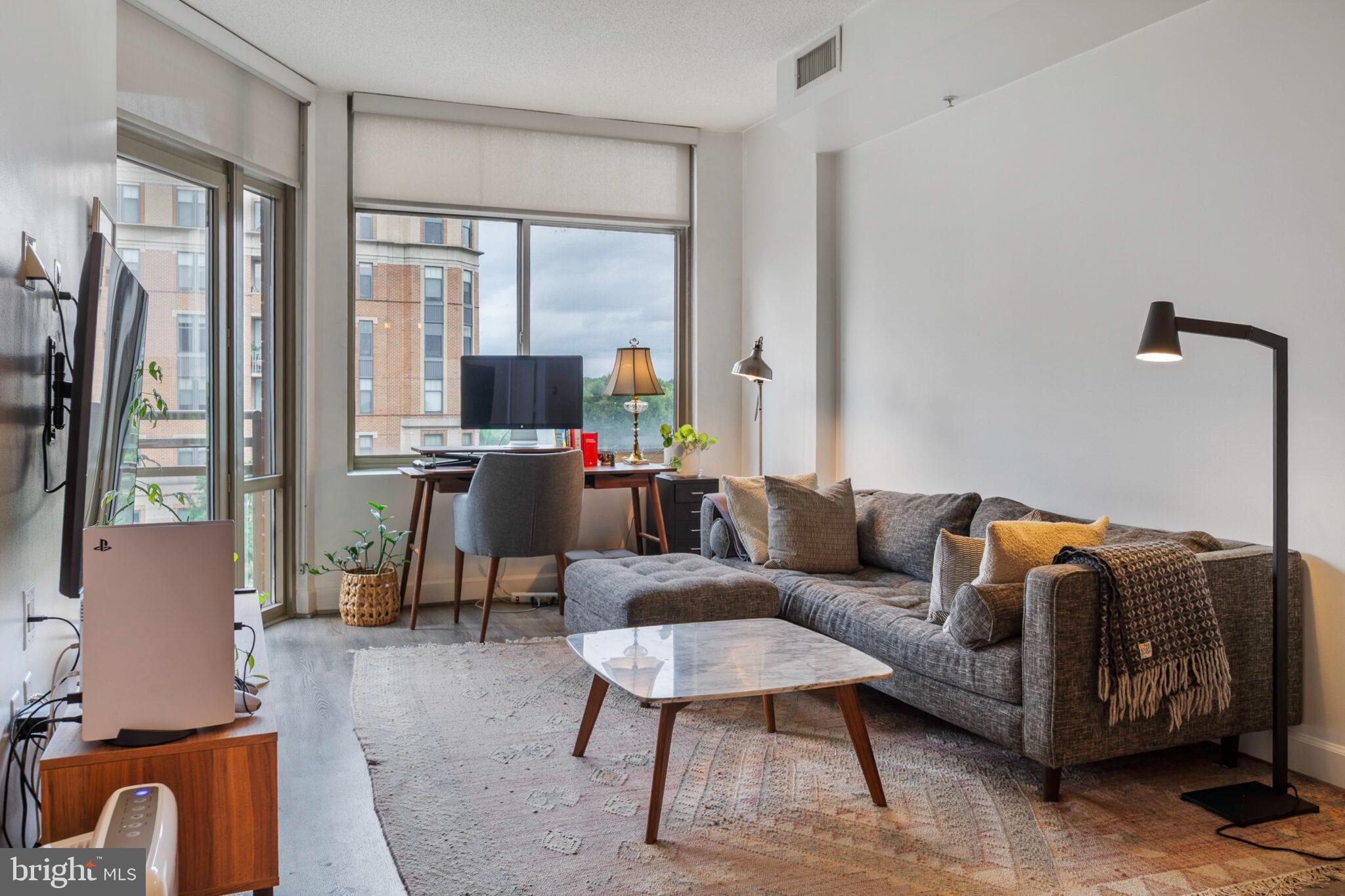 3650 South Glebe Road, Unit 450 Arlington, VA 22202 - Photo 11 of 60 a living room with furniture and a flat screen tv