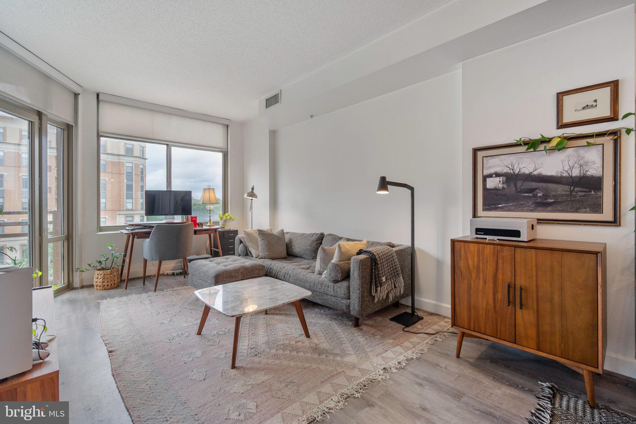 3650 South Glebe Road, Unit 450 Arlington, VA 22202 - Photo 12 of 60 a living room with furniture a flat screen tv and a window