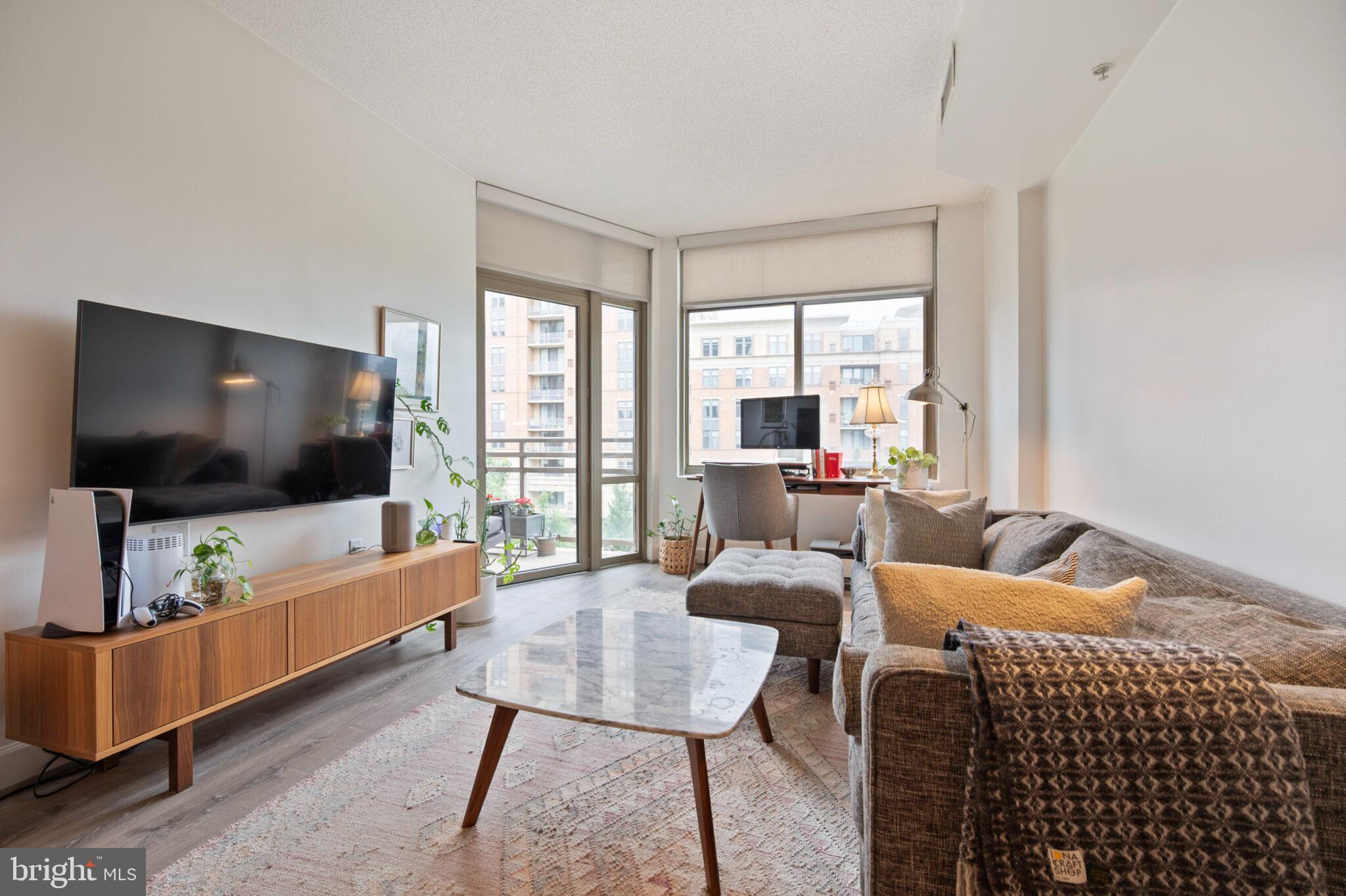3650 South Glebe Road, Unit 450 Arlington, VA 22202 - Photo 14 of 60 a living room with furniture and a flat screen tv