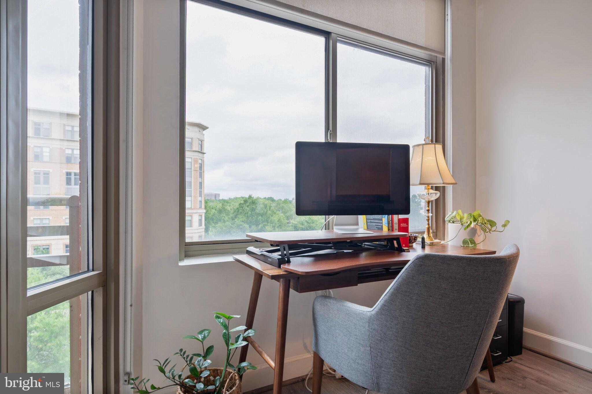 3650 South Glebe Road, Unit 450 Arlington, VA 22202 - Photo 15 of 60 a desktop computer sitting on top of a desk next to a window