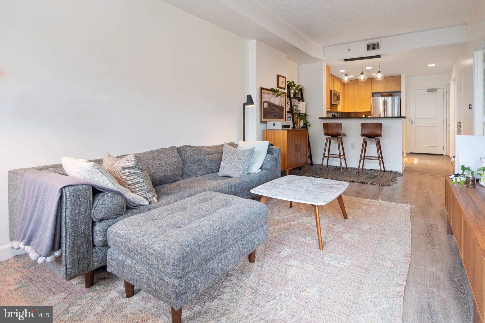 3650 South Glebe Road, Unit 450 Arlington, VA 22202 - Photo 16 of 60 a living room with furniture and a table