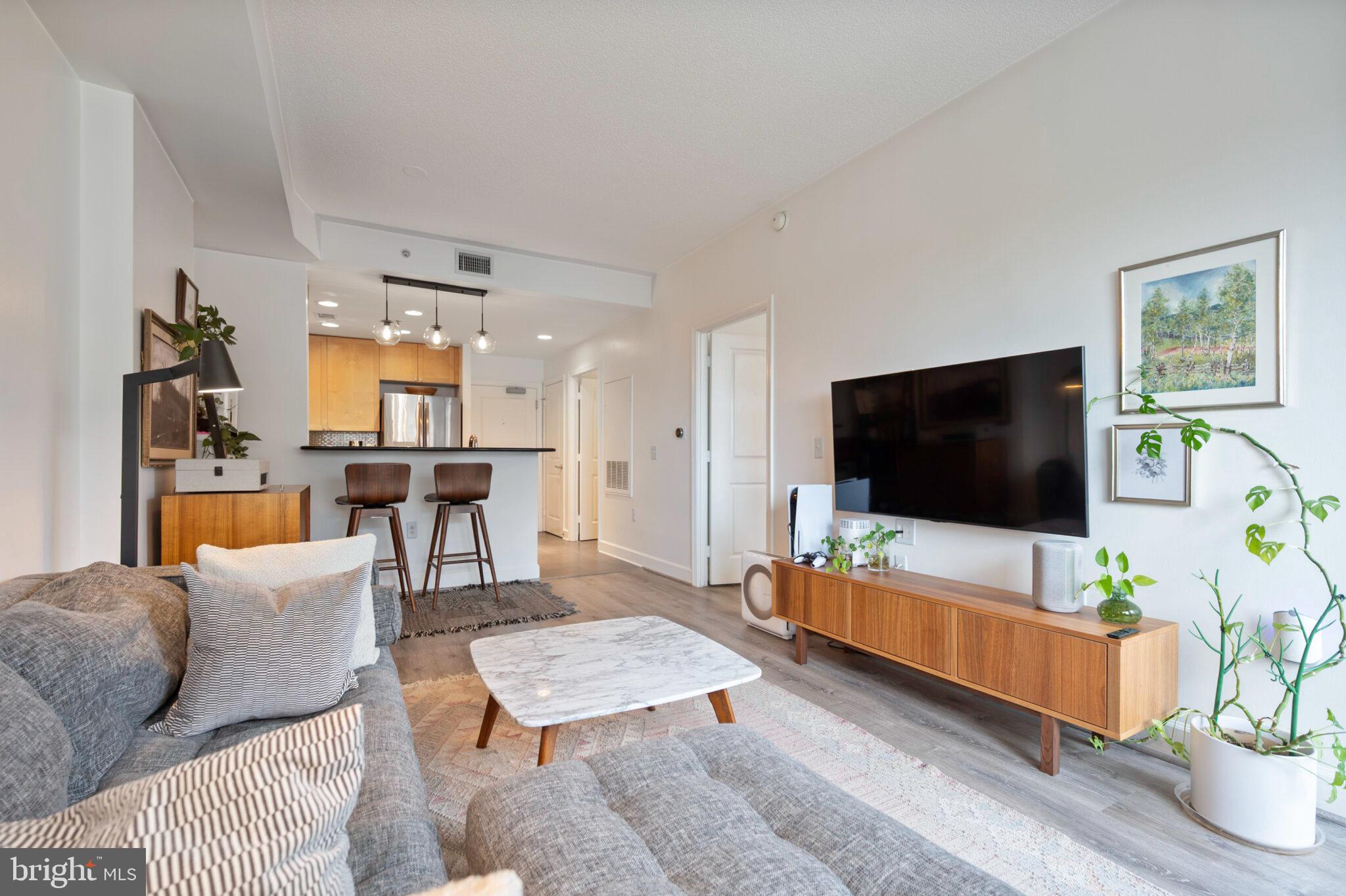 3650 South Glebe Road, Unit 450 Arlington, VA 22202 - Photo 17 of 60 a living room with furniture and a flat screen tv
