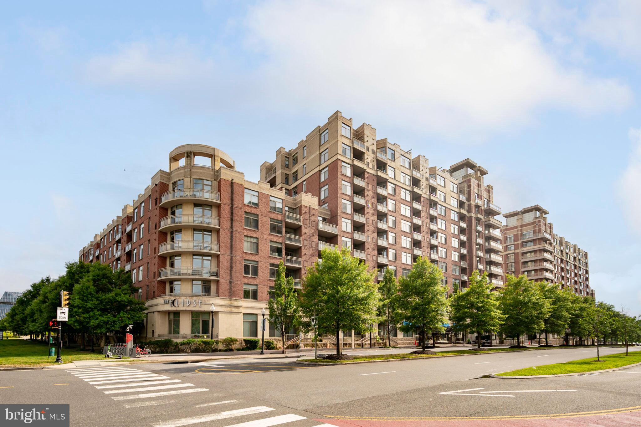 3650 South Glebe Road, Unit 450 Arlington, VA 22202 - Photo 2 of 60 a view of a tall building next to a road