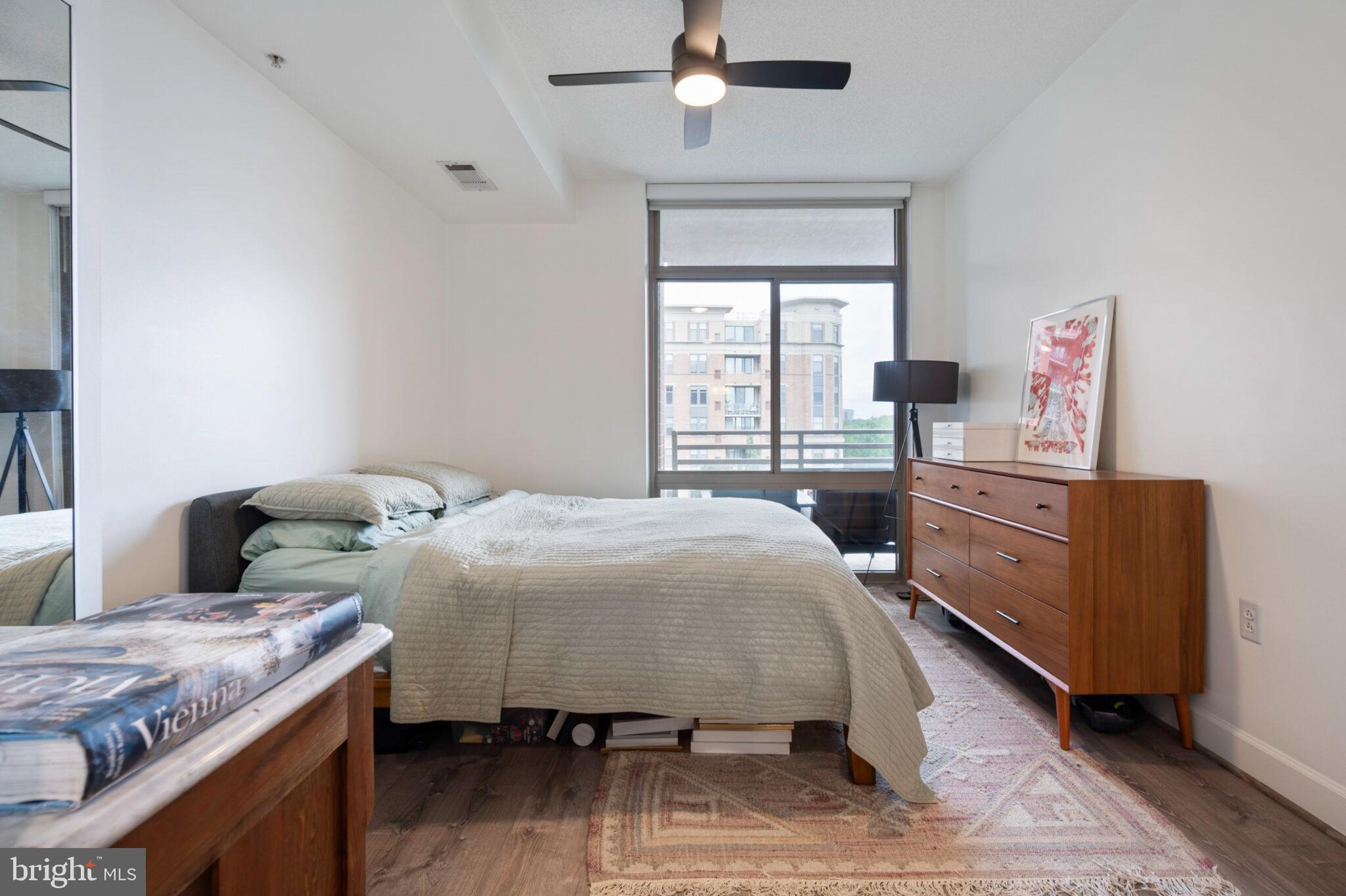 3650 South Glebe Road, Unit 450 Arlington, VA 22202 - Photo 21 of 60 a bedroom with a bed and a dresser