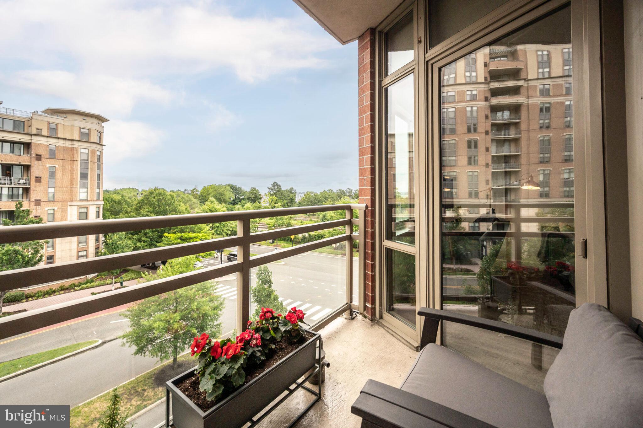 3650 South Glebe Road, Unit 450 Arlington, VA 22202 - Photo 24 of 60 a city view from a balcony with a potted plant