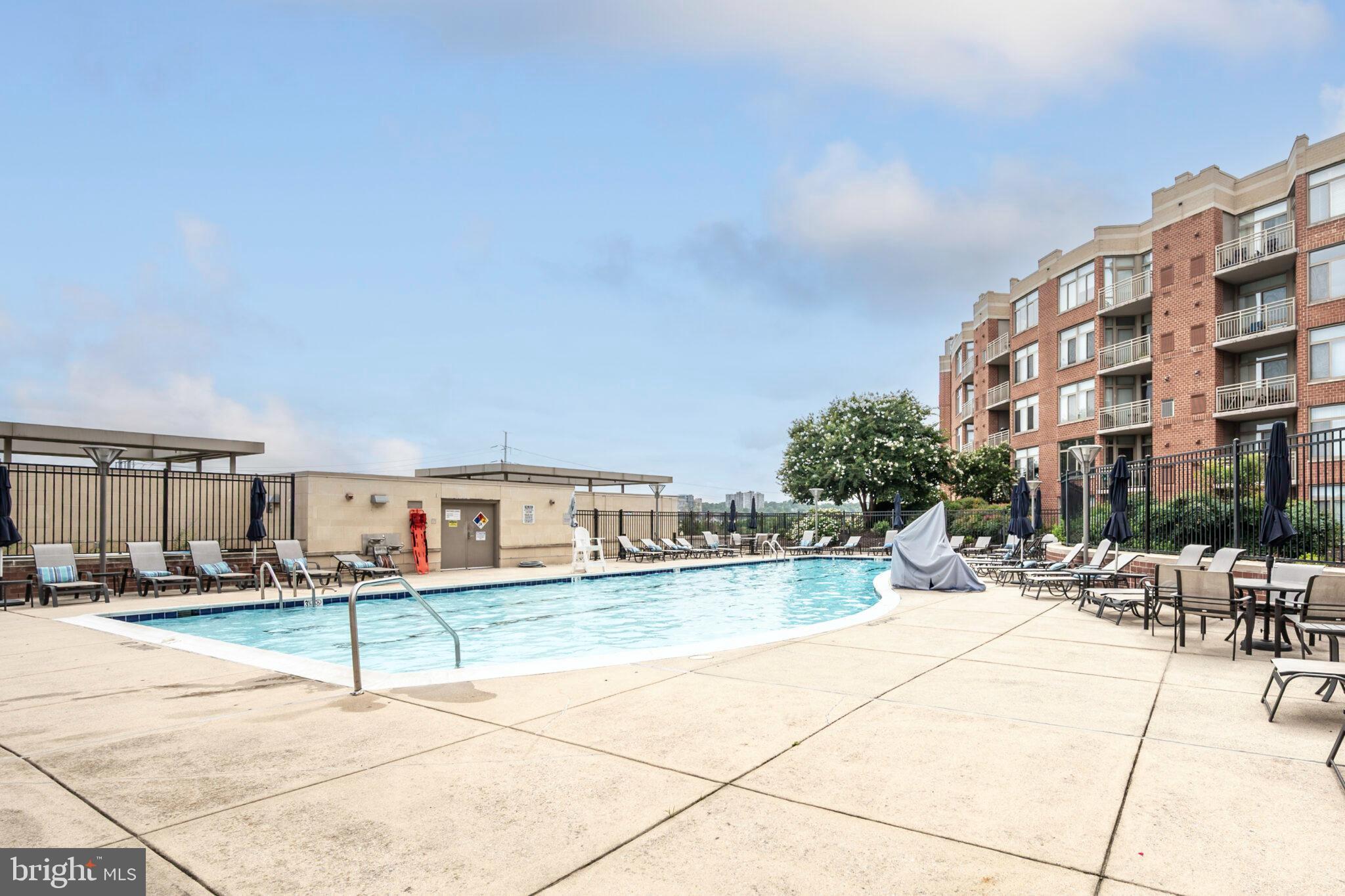 3650 South Glebe Road, Unit 450 Arlington, VA 22202 - Photo 32 of 60 a building with view of building and car parked