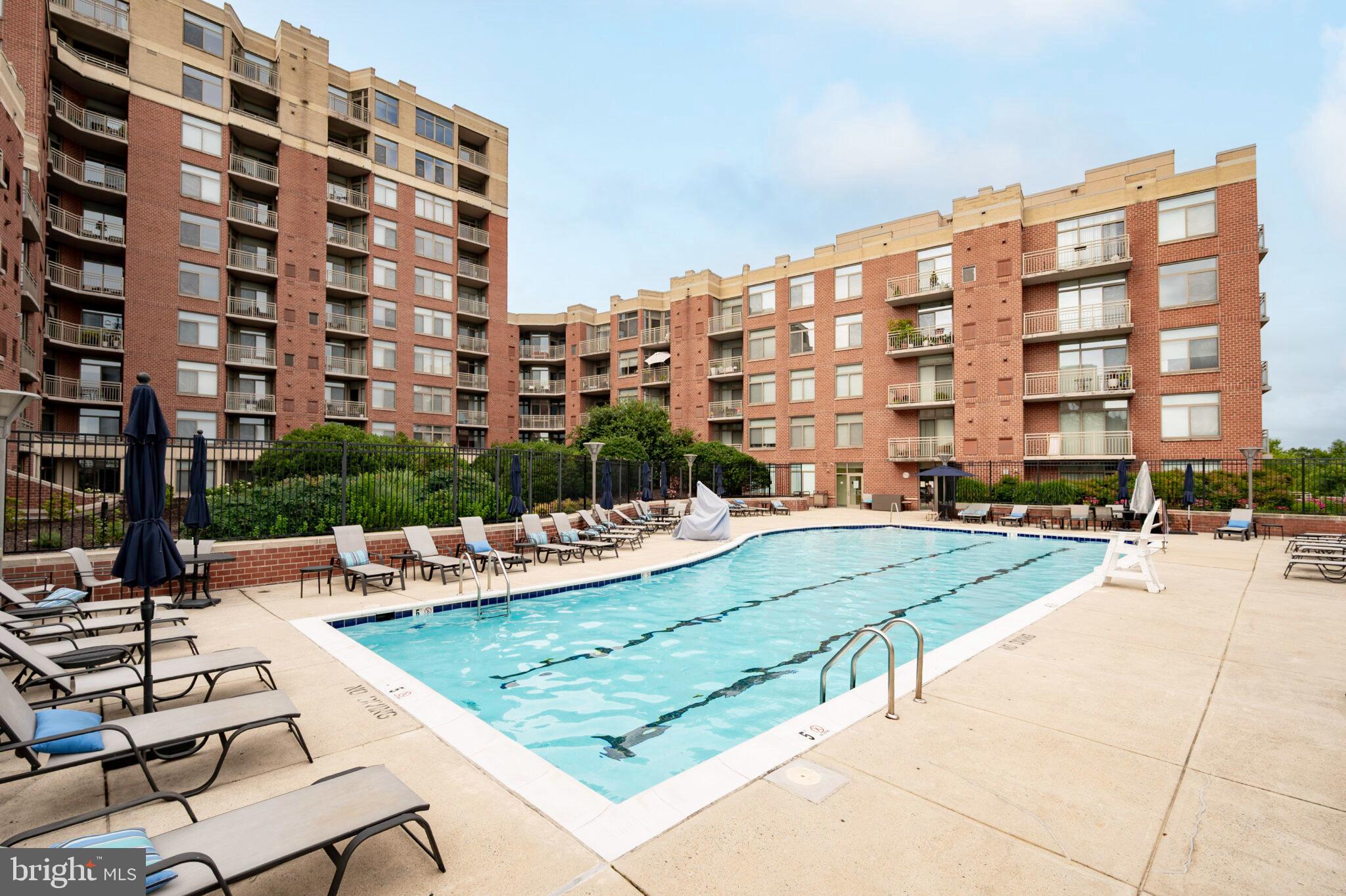 3650 South Glebe Road, Unit 450 Arlington, VA 22202 - Photo 33 of 60 a view of a swimming pool with a patio