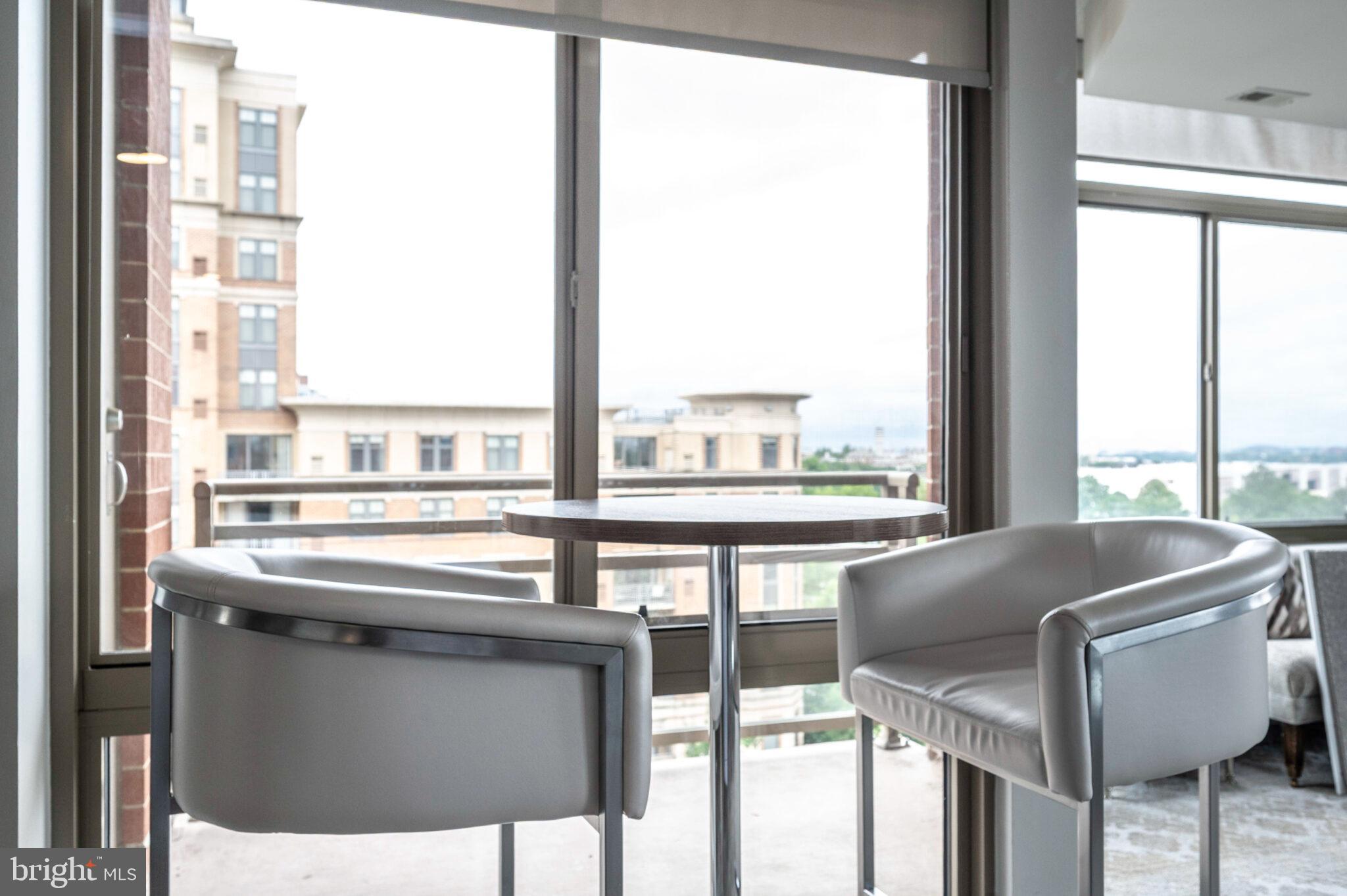 3650 South Glebe Road, Unit 450 Arlington, VA 22202 - Photo 40 of 60 a kitchen view with a sink and chairs